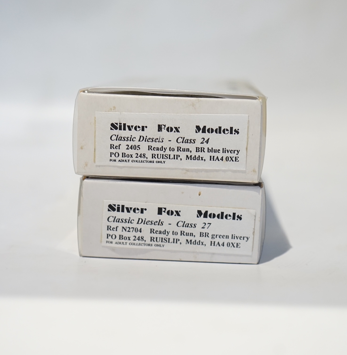 Two boxed Silver Fox Models N gauge BR Bo-Bo diesel locomotives; a Class 24 in dark blue livery, 24 067, and a Class 27 in dark green livery, D5412. Condition - good.